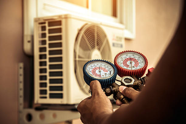 Professional Heat Pump Repair technician working in Hays, KS